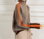 Herringbone turtleneck sweater with orange trim and folded cuff hem