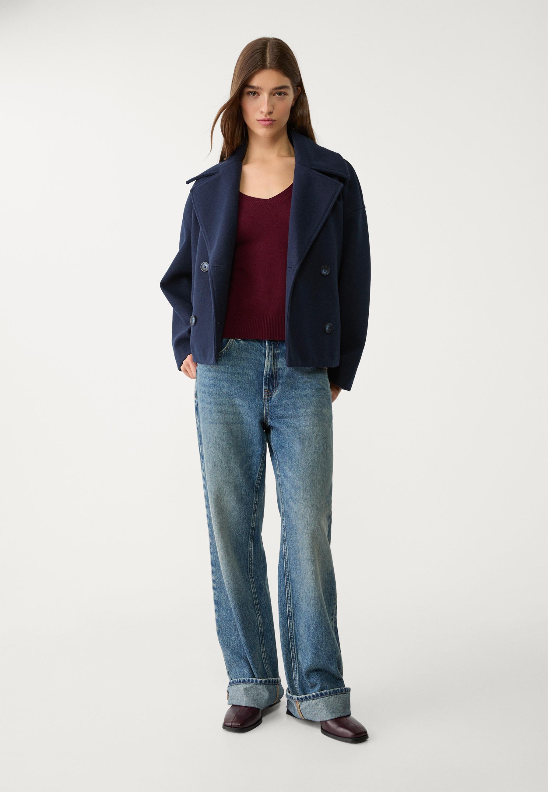 Navy double-breasted cropped blazer with boxy fit, notched lapels, long sleeves