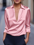 Blush pink V-neck satin blouse with pointed collar and long sleeves