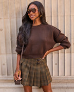 Dark brown cropped crewneck sweater with ribbed hem and 3/4 sleeve cuffs