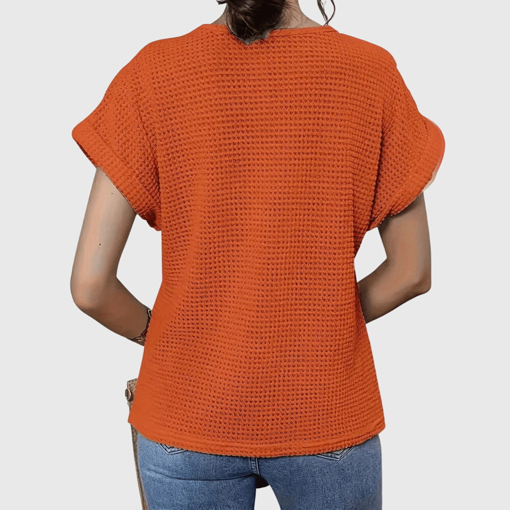 Orange crochet blouse back view with short flutter sleeves