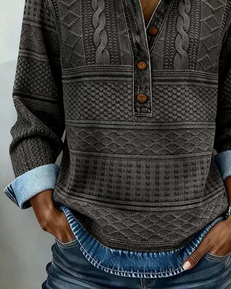Dark gray knit half-button sweatshirt with collar, button placket, and cable-like patterns