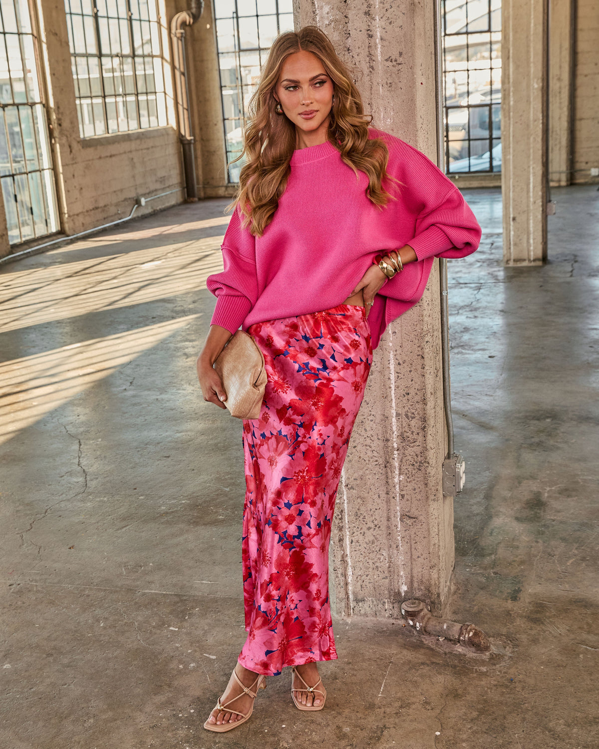 Hot pink oversized knit pullover sweater with relaxed fit and ribbed crew neckline