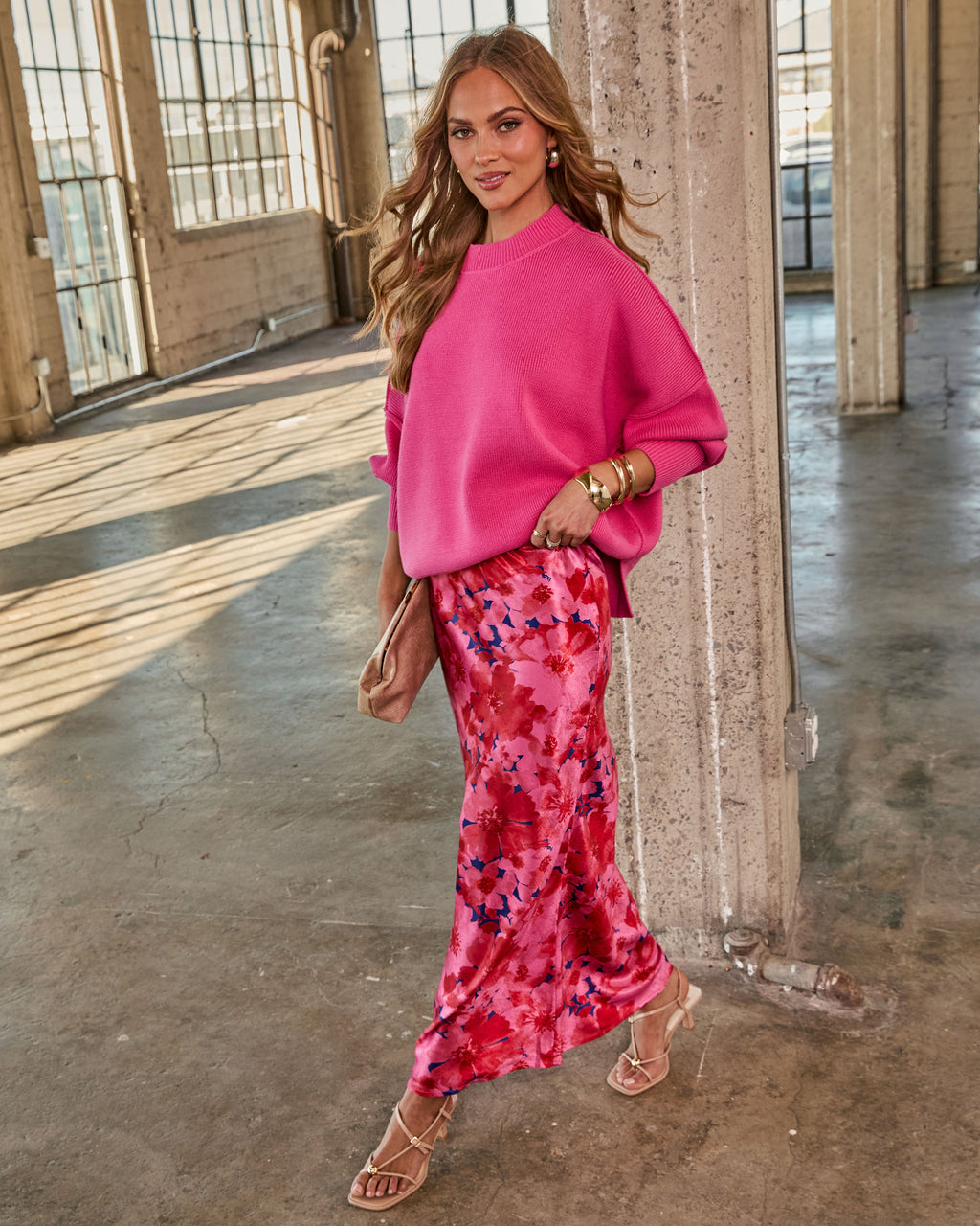 Hot pink oversized knit sweater, crew neck, dropped shoulders, ribbed cuffs.