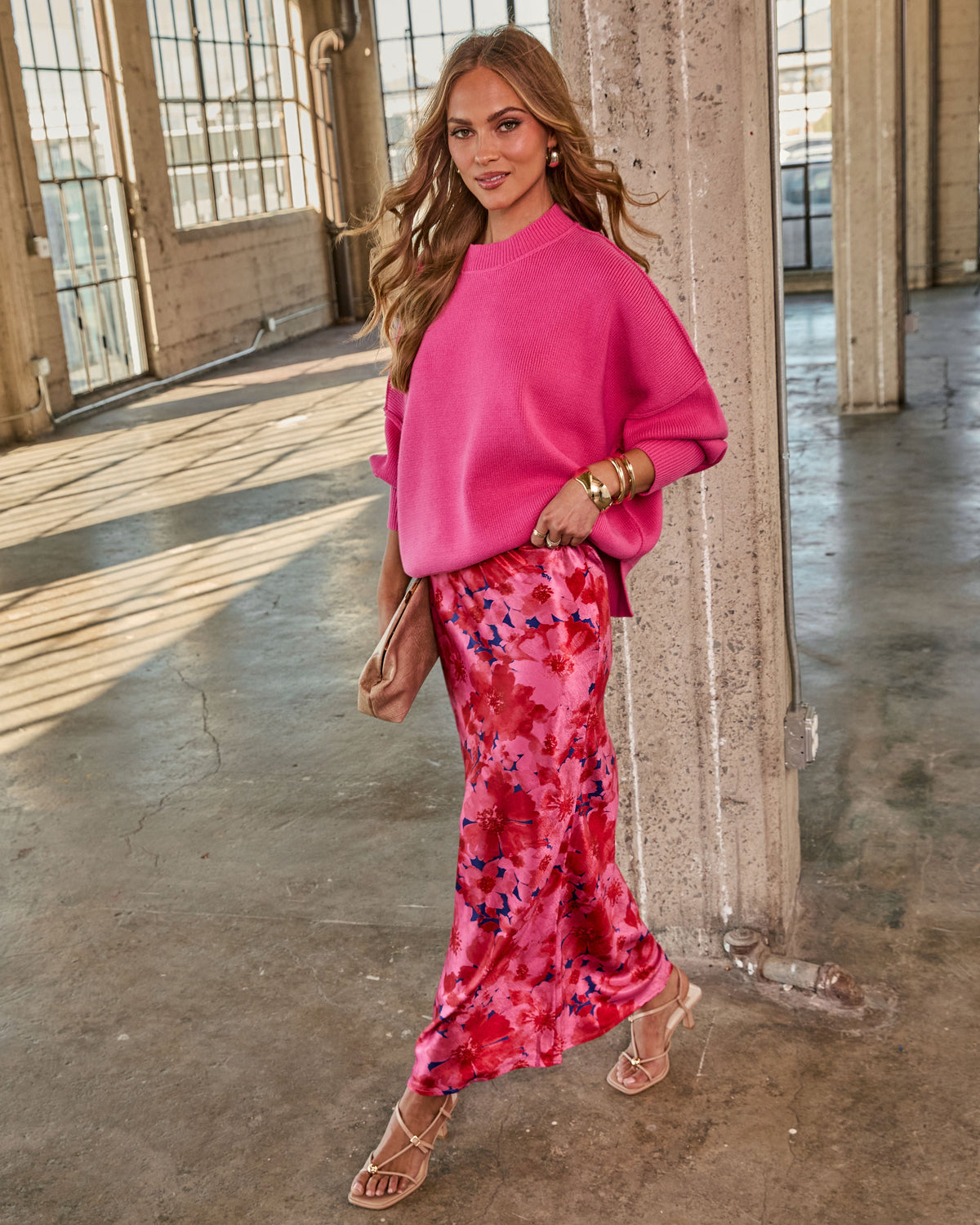 Hot pink oversized knit sweater, crew neck, dropped shoulders, ribbed cuffs.