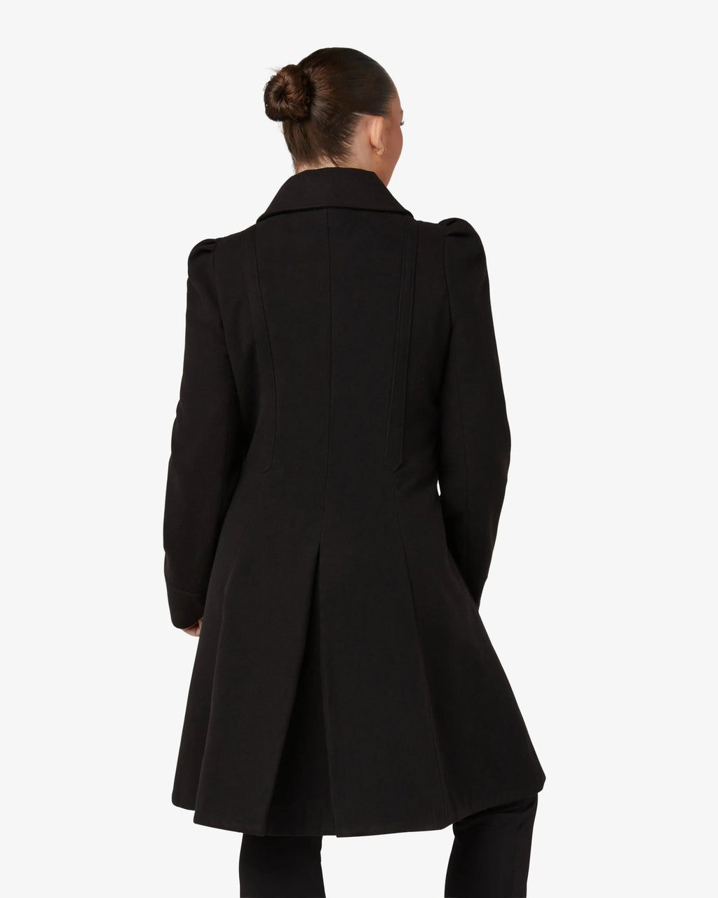 Black double-breasted skater coat, back view with A-line hem