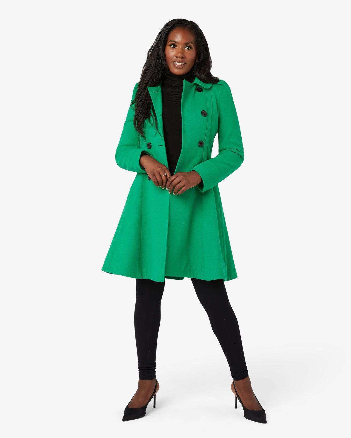 Green double-breasted skater coat with Peter Pan collar, model wearing it.