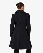 Black double-breasted skater coat with Peter Pan collar, back view, button waist design