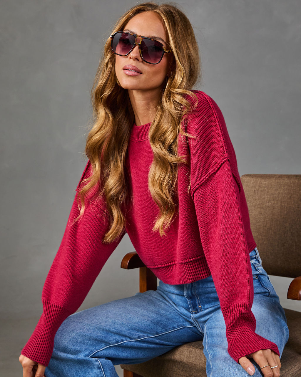 Cropped crewneck knit sweater in deep red with ribbed hem and cuffs