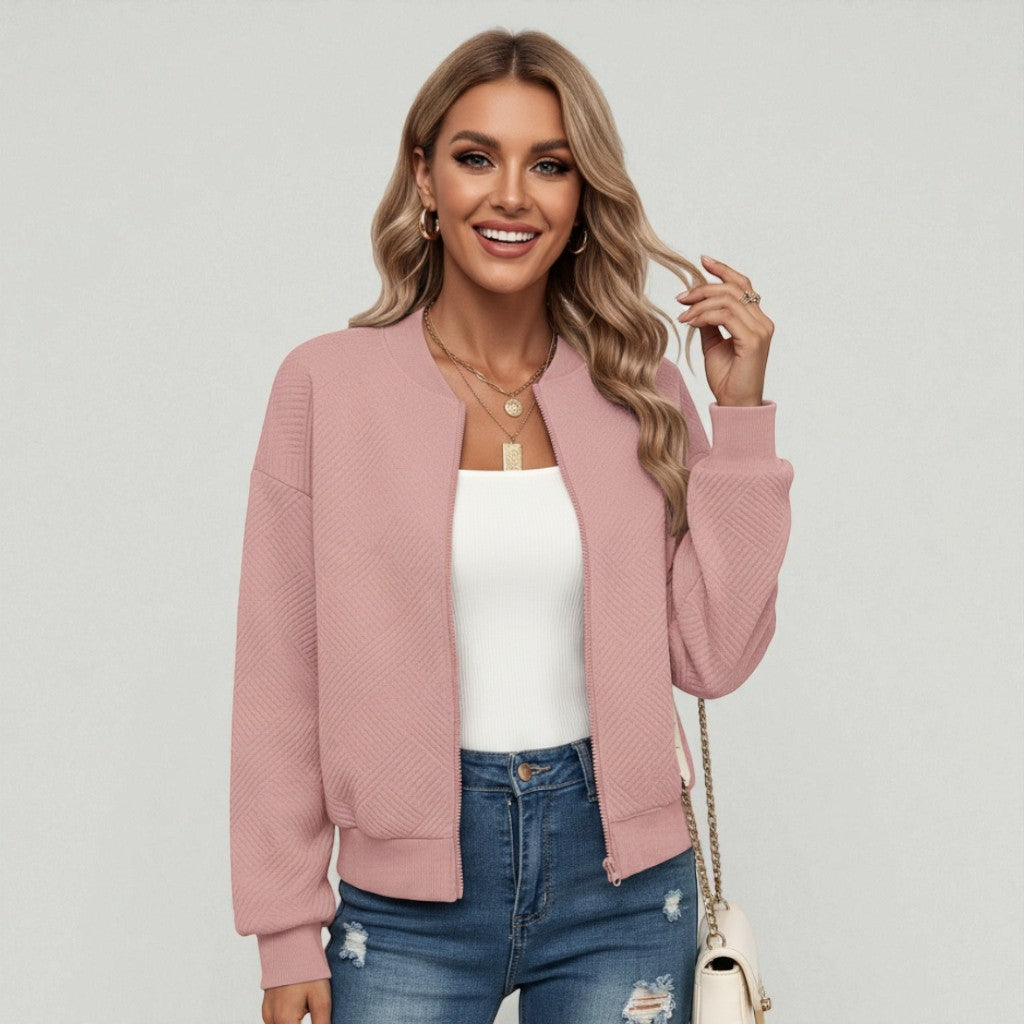 Light-pink cropped textured knit bomber jacket with ribbed cuffs and stand collar.