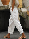 Women's white loose cotton drawstring pants with pockets, ankle-length