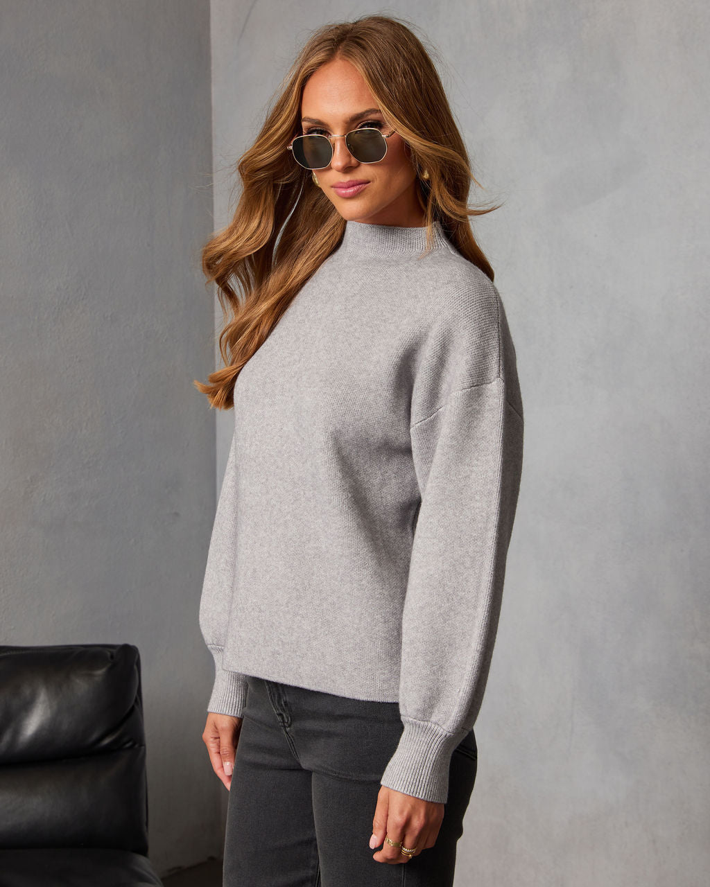 Heather grey mock neck sweater with long sleeves and ribbed cuffs