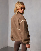 Brown shearling jacket with contrast trim, stand collar, long sleeves
