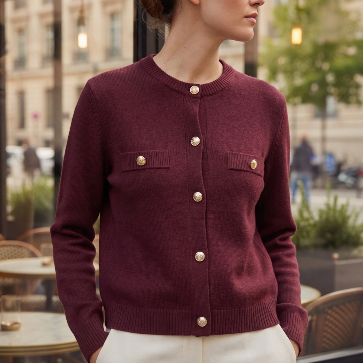 Burgundy knitted long-sleeve cardigan with gold snap buttons and chest patch pockets