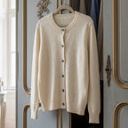 Beige merino wool cardigan with button-front, ribbed crew neckline, long sleeves