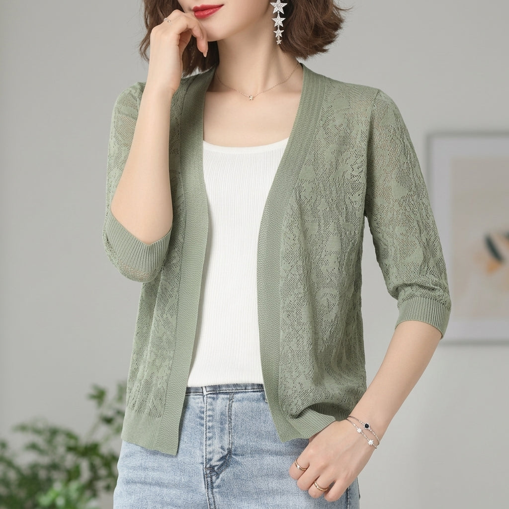 Cropped lace knit cardigan with openwork lace panels and half sleeves in sage green