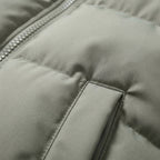 Light grey hooded puffer jacket with stitched panels and seam details