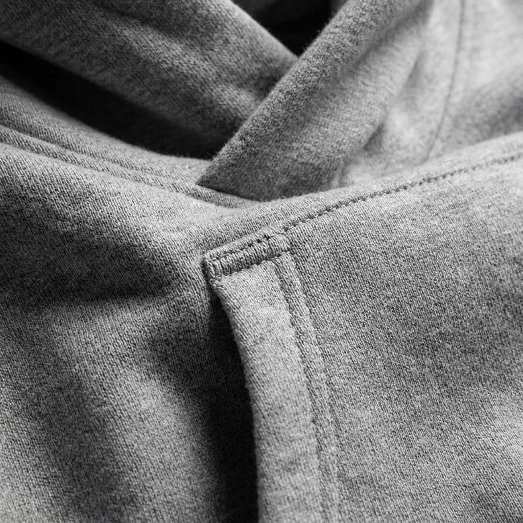 Grey oversized hoodie sleeve cuff seam and pocket opening detail