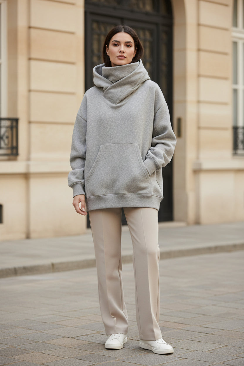 Grey oversized hoodie with kangaroo pocket and hood, model wearing