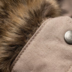 Quilted women’s jacket with faux fur collar and metal snap button detail