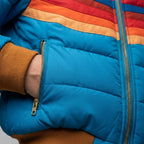 Light blue quilted hooded jacket with front zipper and striped yoke