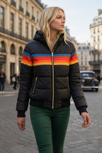 Black quilted hooded jacket with multicolor horizontal stripe across chest