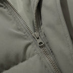 Hooded puffer jacket front zipper with metal pull and stitched panels