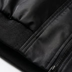 Black oversized bomber jacket hem with ribbed cuff and front zipper detail