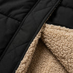 Quilted hooded coat with black outer and beige sherpa lining detail