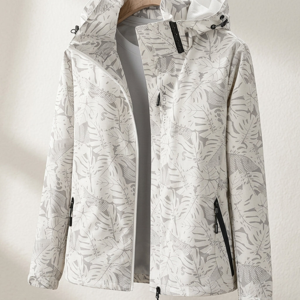 White lightweight zip-up jacket with hood, leaf pattern, adjustable cuffs and front pockets
