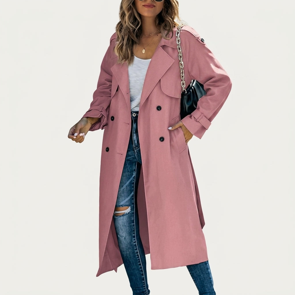 Long pink trench coat with double-breasted buttons and notched lapels, flap pockets