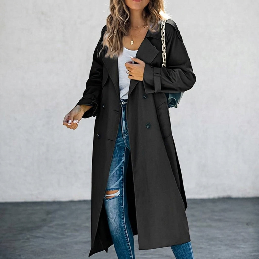 Long black trench coat with double-breasted buttons and notched lapels, flap pockets