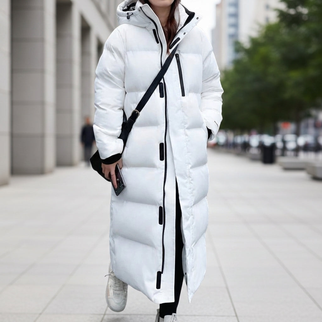 Women's long white hooded quilted puffer parka with black zipper trim and side pockets