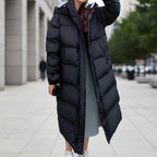 Women's long black hooded quilted puffer parka with center front zipper and side pockets