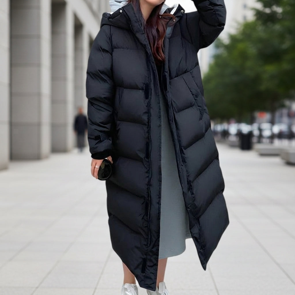 Women's long black hooded quilted puffer parka with center front zipper and side pockets