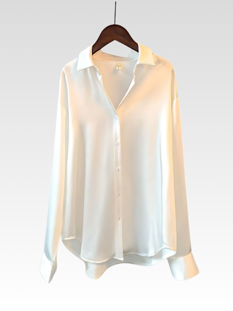 White satin-style button-up shirt blouse on hanger with pointed collar and long sleeves