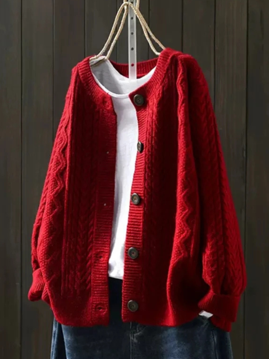 Red cable-knit cardigan with button placket and chunky ribbed hem