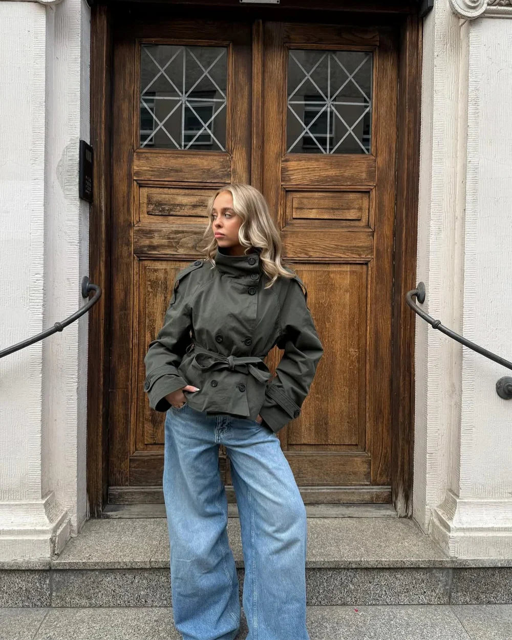 Cropped trench coat in dark olive green with button front and waist belt