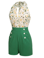 Green floral halter romper with white daisy print top panel and button-front waistband