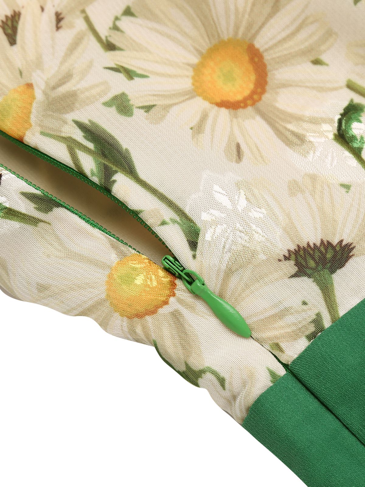 Floral print fabric detail with green zipper tape along seam and daisy illustration