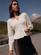 Women’s cropped V-neck cardigan, textured knit, pearl-button front, long sleeves, light beige