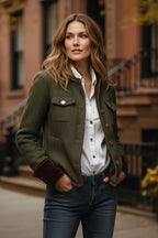 Dark herringbone tweed jacket with two flap pockets and gold-tone button details