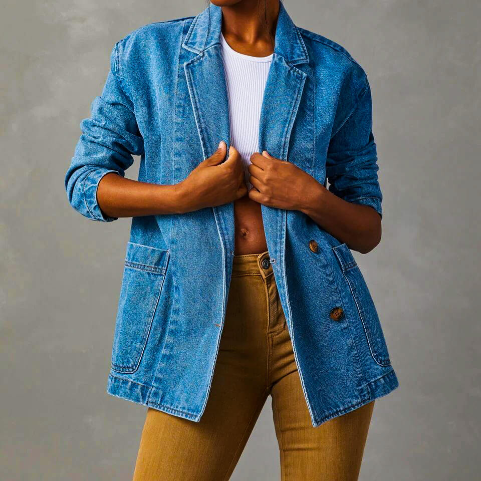 Light blue denim blazer with notched collar, two-button front, flap pockets, relaxed fit