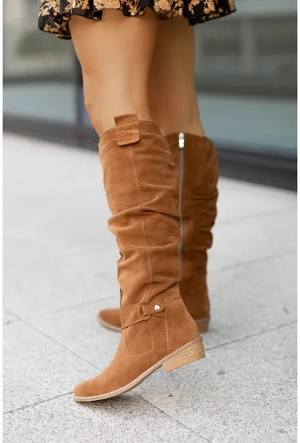 Women’s tan suede ankle boots with stacked heel and top strap detail
