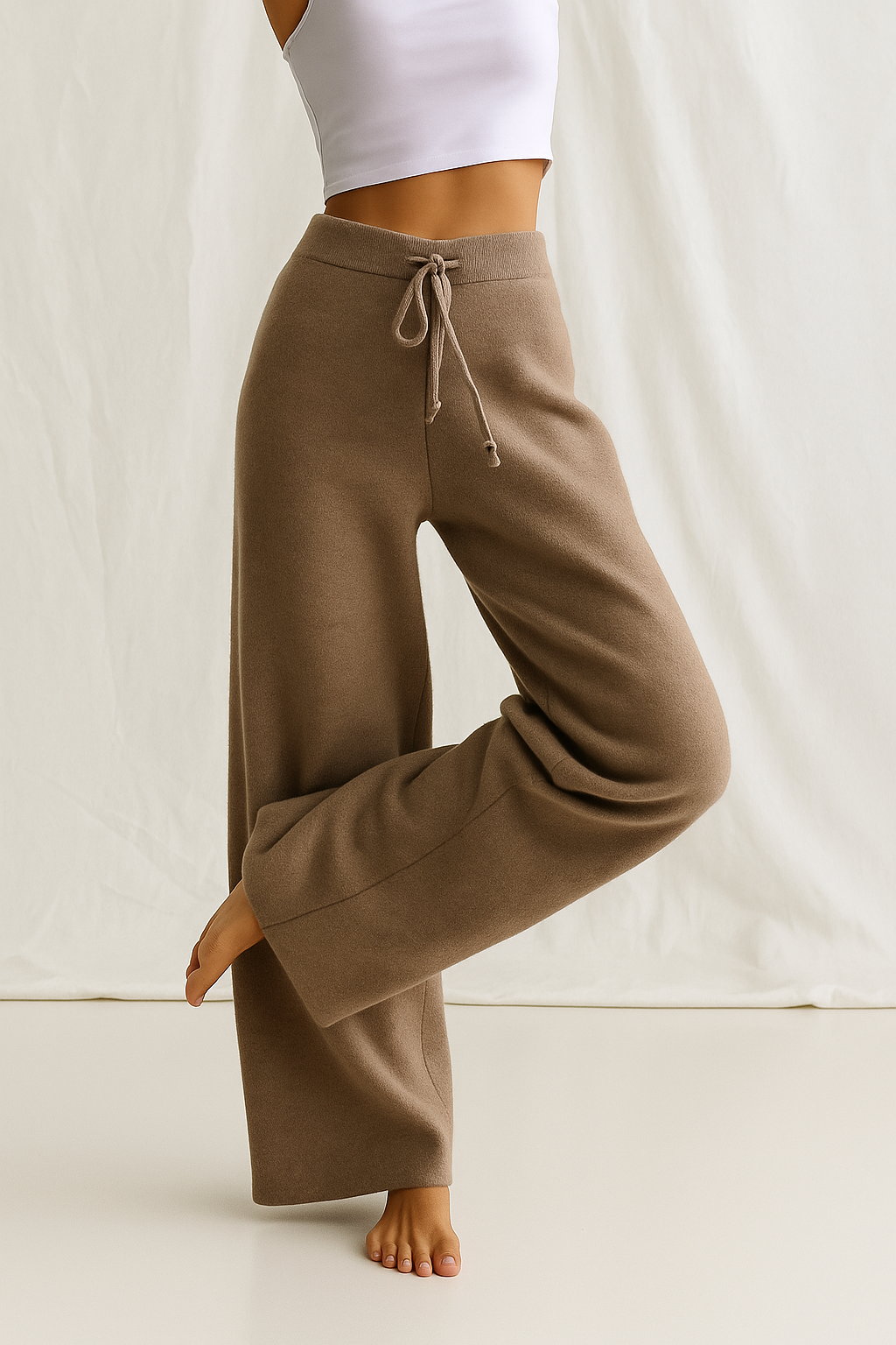 High-waisted wide-leg lounge pants in dark brown tan with drawstring waistband and cuffed hem
