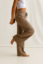 High-waisted wide-leg lounge pants in medium brown tan, drawstring tie and side pockets