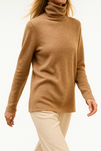Women's slim-fit turtleneck knit sweater, tan camel knit, long sleeves, ribbed turtleneck.