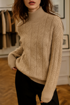 Beige cable knit mock neck sweater with long sleeves and textured knit pattern