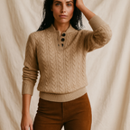 Women’s cable knit button-collar sweater in tan, long sleeves, dark button placket, ribbed hem.