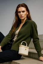 Dark green zip-up cardigan with ribbed knit and stand collar